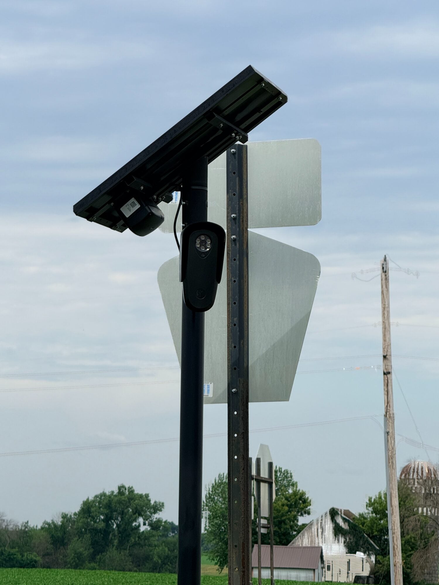 Close-up of a Flock automated license plate reader camera mounted on a pole