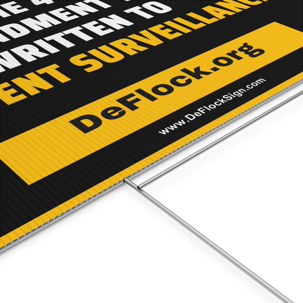 Yard sign with an arrow pointing upwards, and a message that says "The 4th Amendment Was Written to Prevent Surveillance" to indicate that above the sign is a flock camera.
