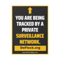 Yard sign with an arrow pointing upwards, and a message that says "You are being tracked by a private surveillance network" to indicate that above the sign is a surveillance camera.