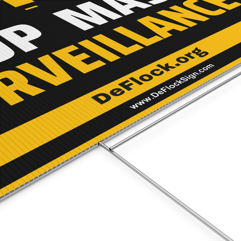 Yard sign with an arrow pointing upwards, and a message that says "Stop Mass Surveillance" to indicate that above the sign is a surveillance camera.