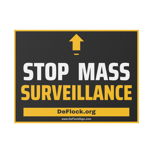 Yard sign with an arrow pointing upwards, and a message that says "Stop Mass Surveillance" to indicate that above the sign is a surveillance camera.