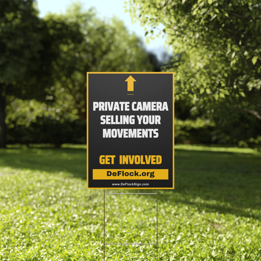 Yard sign with an arrow pointing upwards, and a message that says "Private Camera Selling Your Movements" to indicate that above the sign is a flock camera.