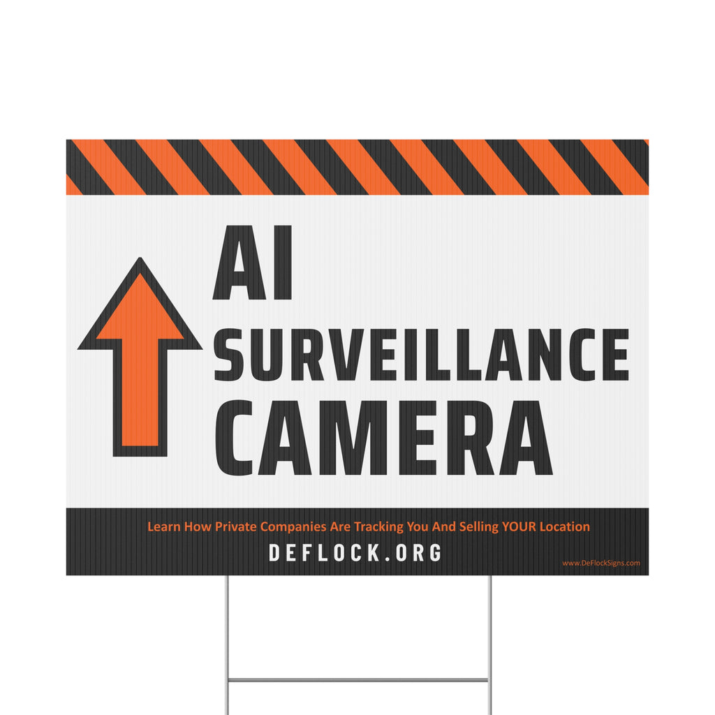 Yard sign with an arrow pointing upwards, and a message that says "AI Surveillance Camera" to indicate that above the sign is a surveillance camera.