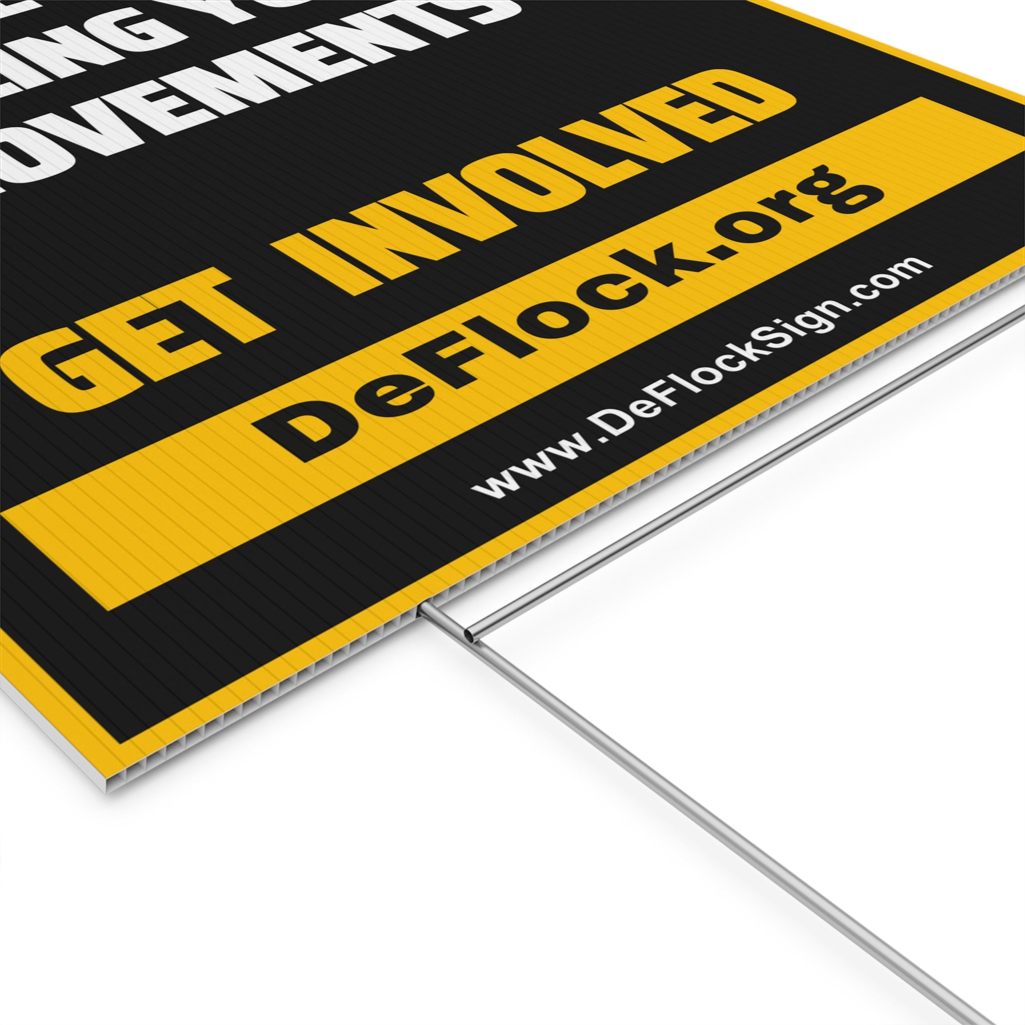 Yard sign with an arrow pointing upwards, and a message that says "Private Camera Selling Your Movements" to indicate that above the sign is a flock camera.
