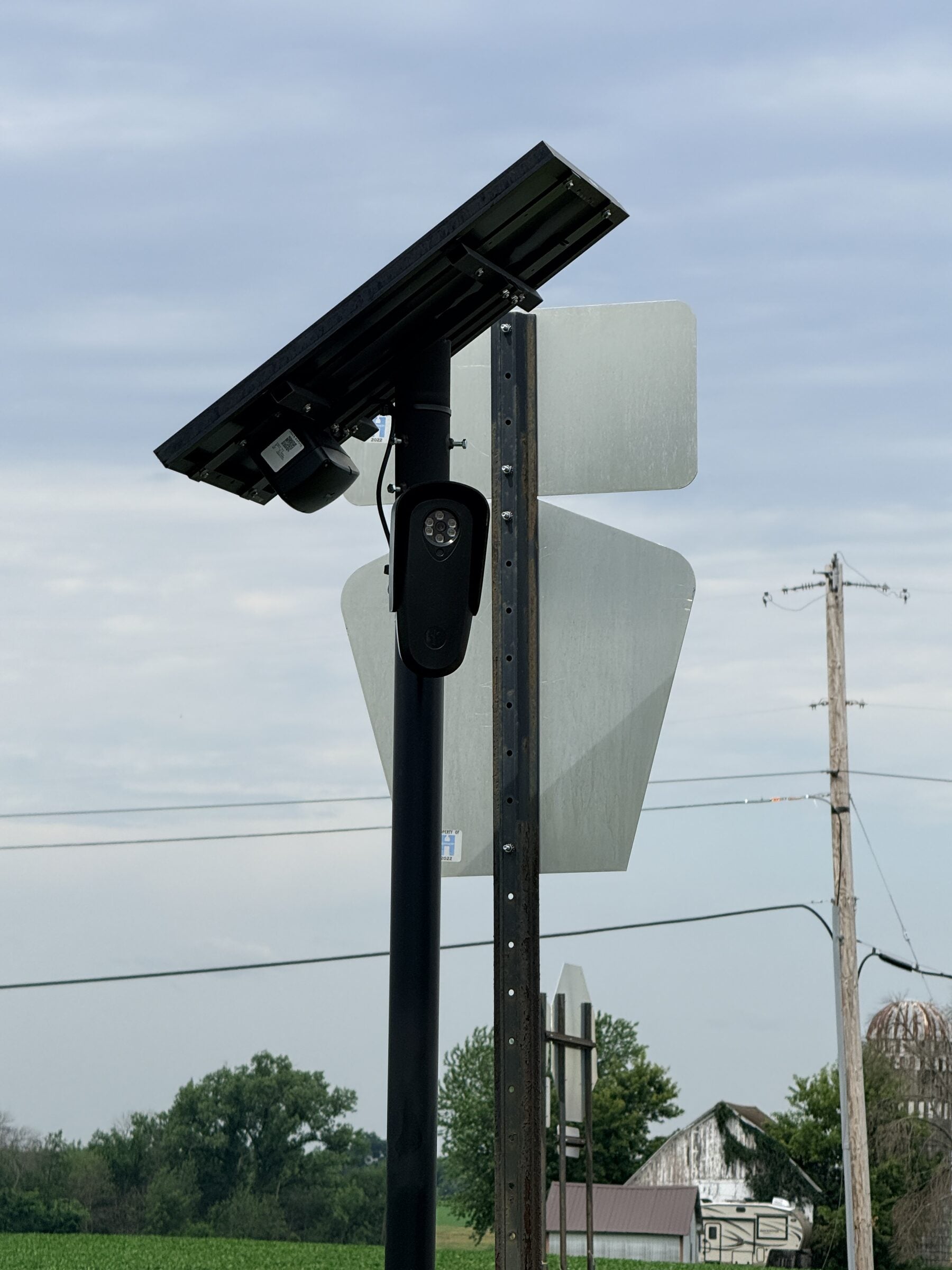 Flock ALPR camera, solar panel, and pole labelled